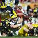 Michigan linebacker Jake Ryan recovers a fumbled South Carolina ball in the second quarter against South Carolina in the Outback Bowl in Tampa, Fla. on Tuesday, Jan. 1. Melanie Maxwell I AnnArbor.com
